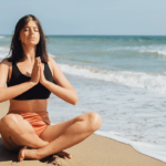 A young woman meditating to practice practical self-care